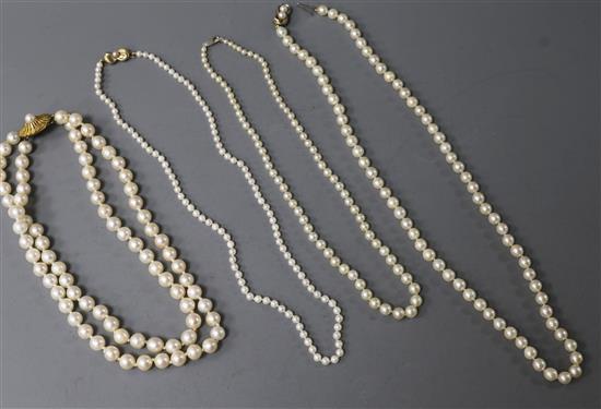 Four assorted cultured pearl necklaces including double strand with 9ct gold clasp.